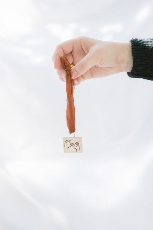 ornament: pinky promise